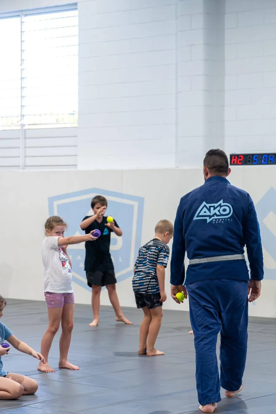 Kids class training with a coach at Ako Martial Arts